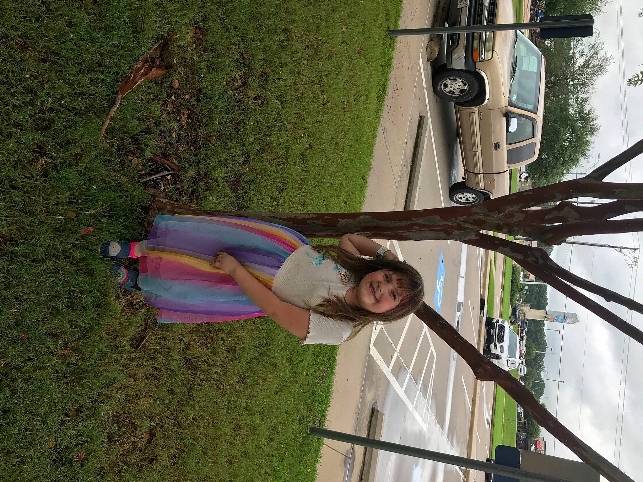 Alaina joined the competition — help win amazing prizes! automotive_exterior, automotive_window_part, car, family_car, fun, grass, joy, leisure, line, metal, person, plant, pole, smile, tire, tree, vehicle, vehicle_door, wheel, window