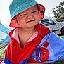 Alezio a rejoint le concours — aidez-le/la à gagner de superbes lots ! toddler, child, bucket_hat, towel, outdoor, grass, car, playful, face_expression, summer, sunlight, blue, red, toy_crab_design, cute, portrait, smile, nature, young_child, vacation
