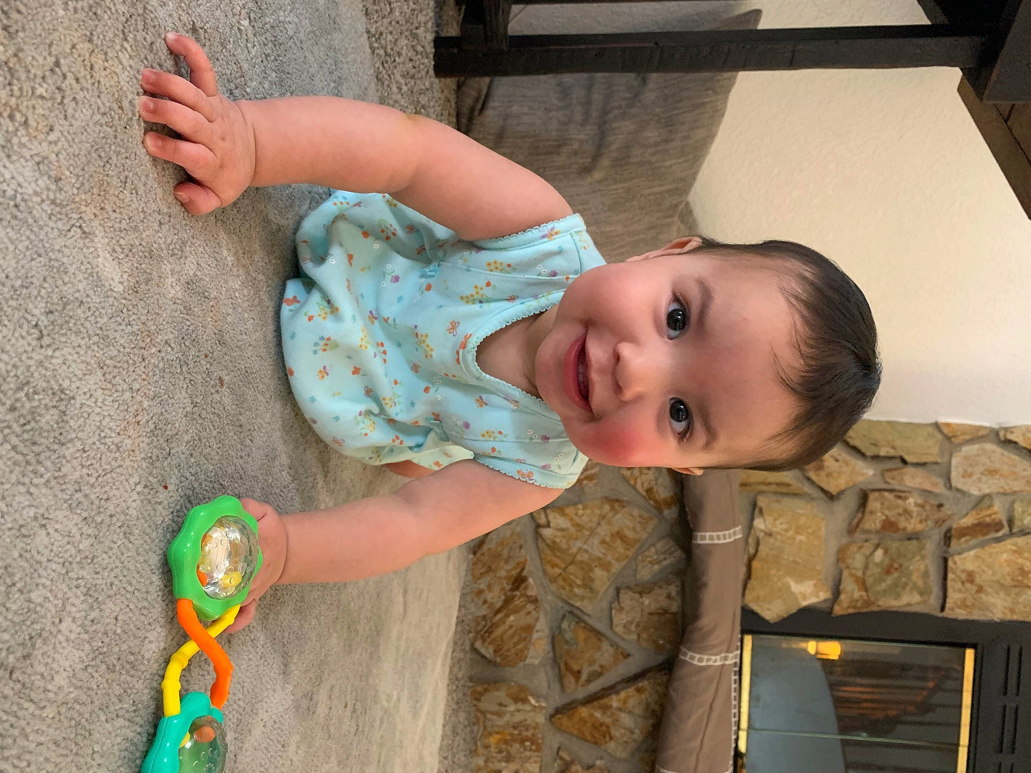 Liana is registered to the contest to win money with this photo: baby, baby_toddler_clothing, child, eye, flooring, foot, fun, grass, hand, happy, human_leg, joy, leisure, pattern, people_in_nature, person, sitting, skin, smile, toddler