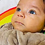 baby, infant, face, eyes, blanket, soft, curious, portrait, closeup, child, cute, indoors, colorful, rainbow, warm, expression, head, skin, person, newborn