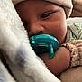 baby, pacifier, blanket, hat, sleepy, closeup, infant, cozy, child, soft, cuddle, peaceful, resting, cute, face, hand, clothing, indoors, skin, portrait