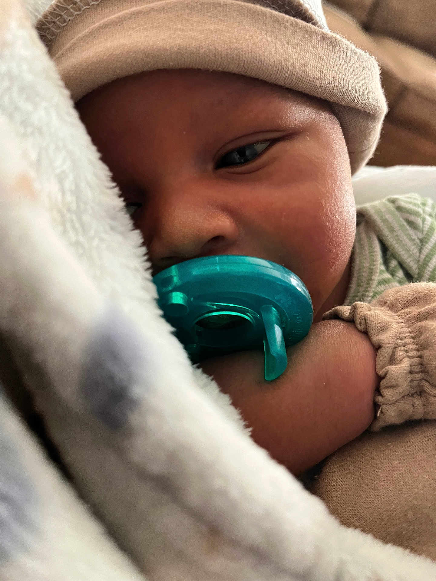 Seven is registered to the contest to win money with this photo: baby, pacifier, blanket, hat, sleepy, closeup, infant, cozy, child, soft, cuddle, peaceful, resting, cute, face, hand, clothing, indoors, skin, portrait