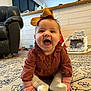 baby, child, smiling, sitting, carpet, indoor, clothing, bow, sock, happy, face, person, home, furniture, toy, floor, cute, infant, portrait, cozy