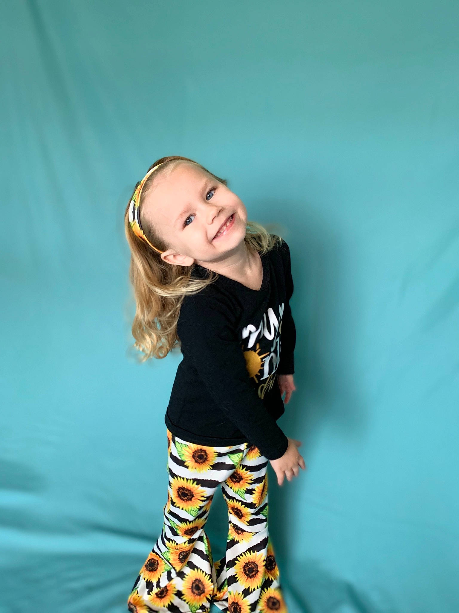 Fiona joined the competition — help win amazing prizes! blond, blue, child, child_model, green, happy, joy, leggings, long_hair, person, photo_shoot, photography, sleeve, smile, style, t_shirt, tights, trunk, waist, yellow