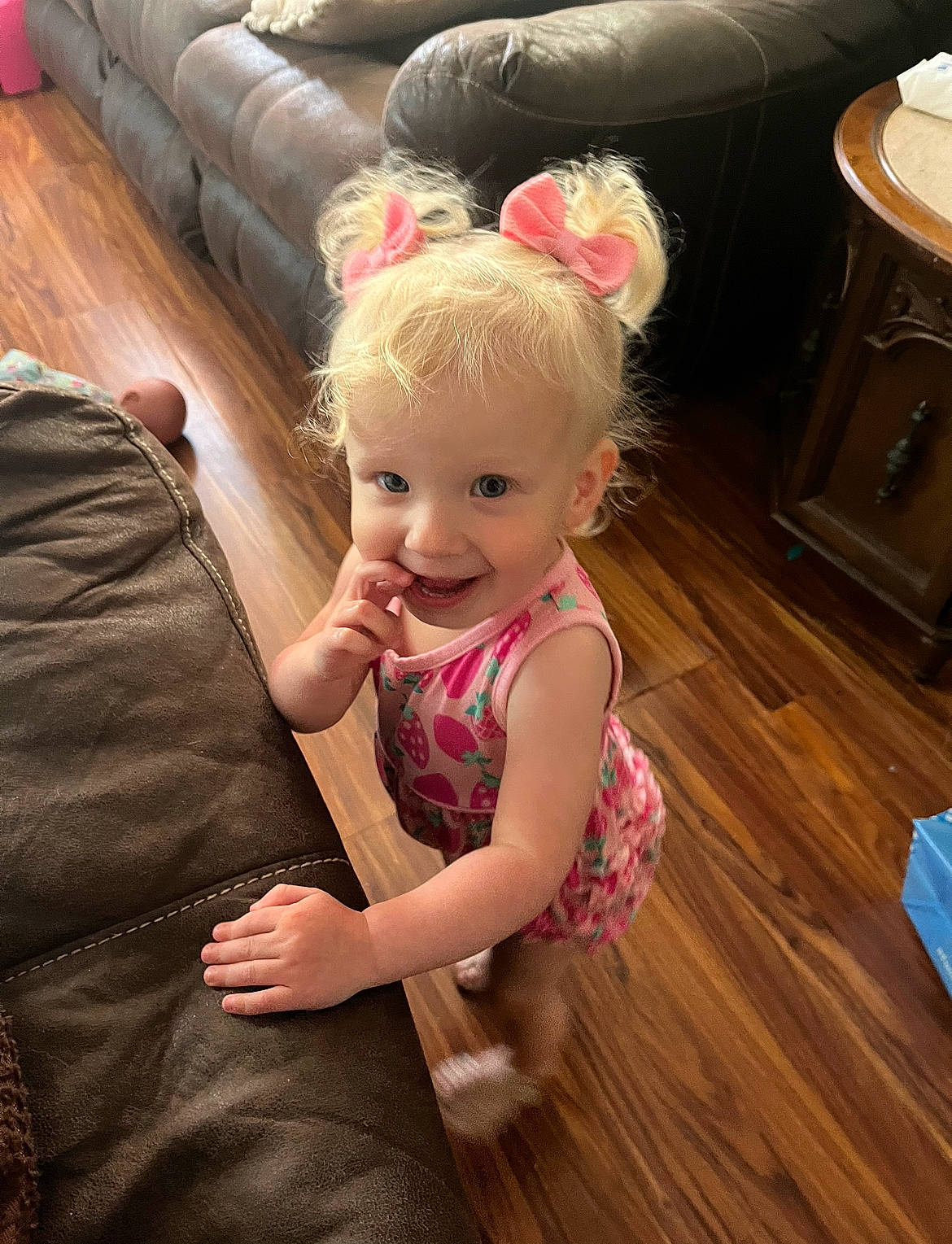 Blakely is registered to the contest to win money with this photo: baby_toddler_clothing, blond, child, comfort, couch, eye, floor, flooring, fun, happy, hardwood, head, human_body, iris, joy, living_room, person, skin, smile, toddler