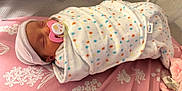 Caitlynn is registered to the contest to win money with this photo: architecture, baby, bed, blanket, bonnet, building, clothing, crib, face, furniture, glove, hat, head, hospital, infantbed, newborn, person, photography, portrait, sleeping