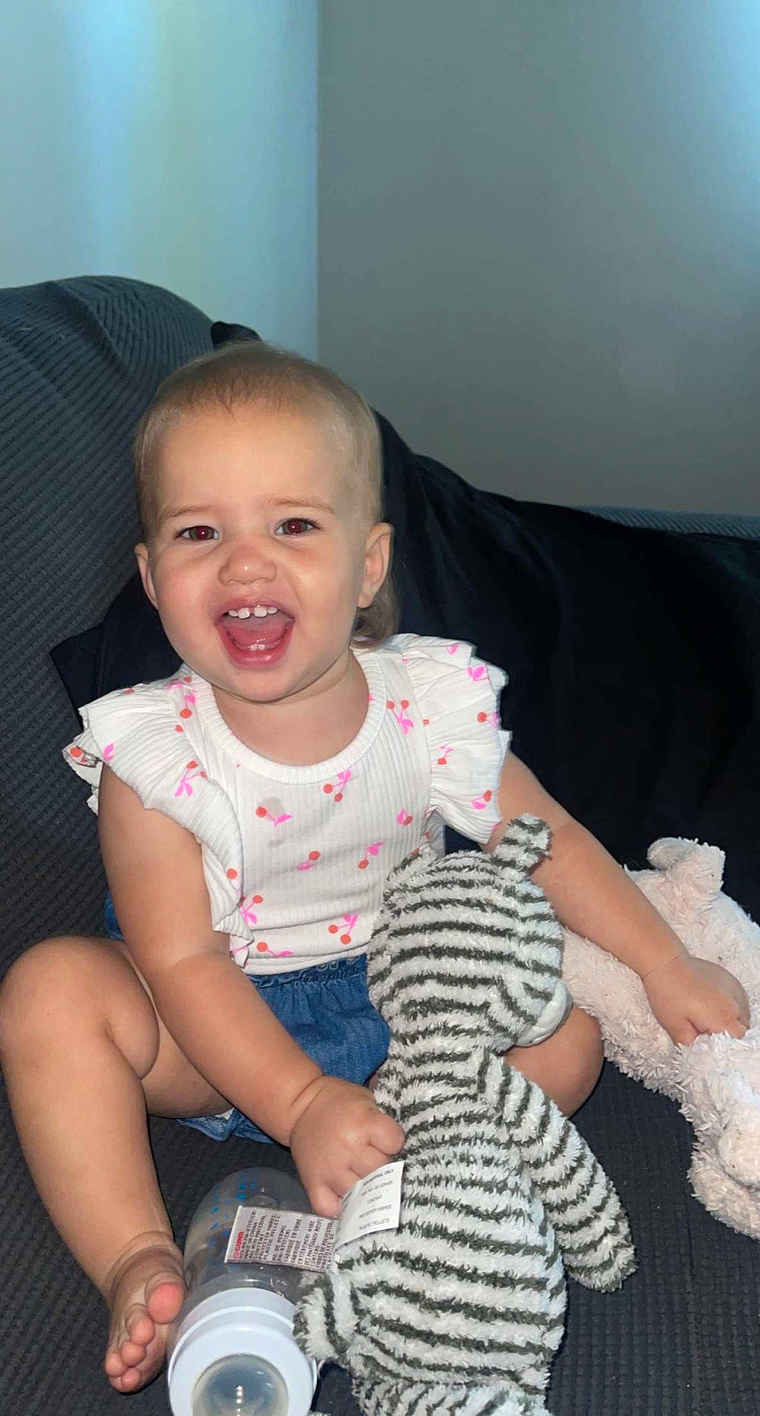 Alively is registered to the contest to win money with this photo: baby, baby_toddler_clothing, beauty, cheek, child, chin, comfort, eye, finger, happy, head, iris, mouth, pattern, person, pink, skin, sleeve, smile, t_shirt