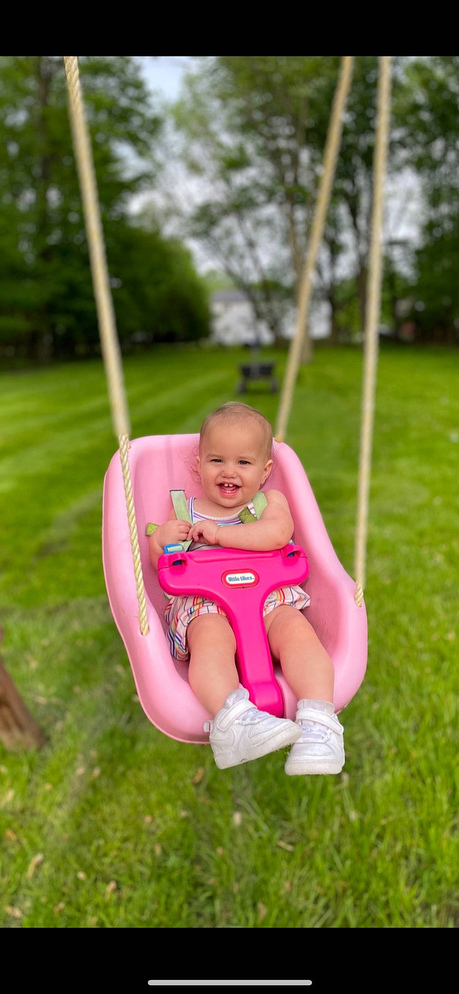 Alively joined the competition — help win amazing prizes! baby, baby_toddler_clothing, child, city, fun, grass, happy, joy, leisure, magenta, outdoor_play_equipment, people_in_nature, person, pink, plant, playground, recreation, smile, swing, thumb
