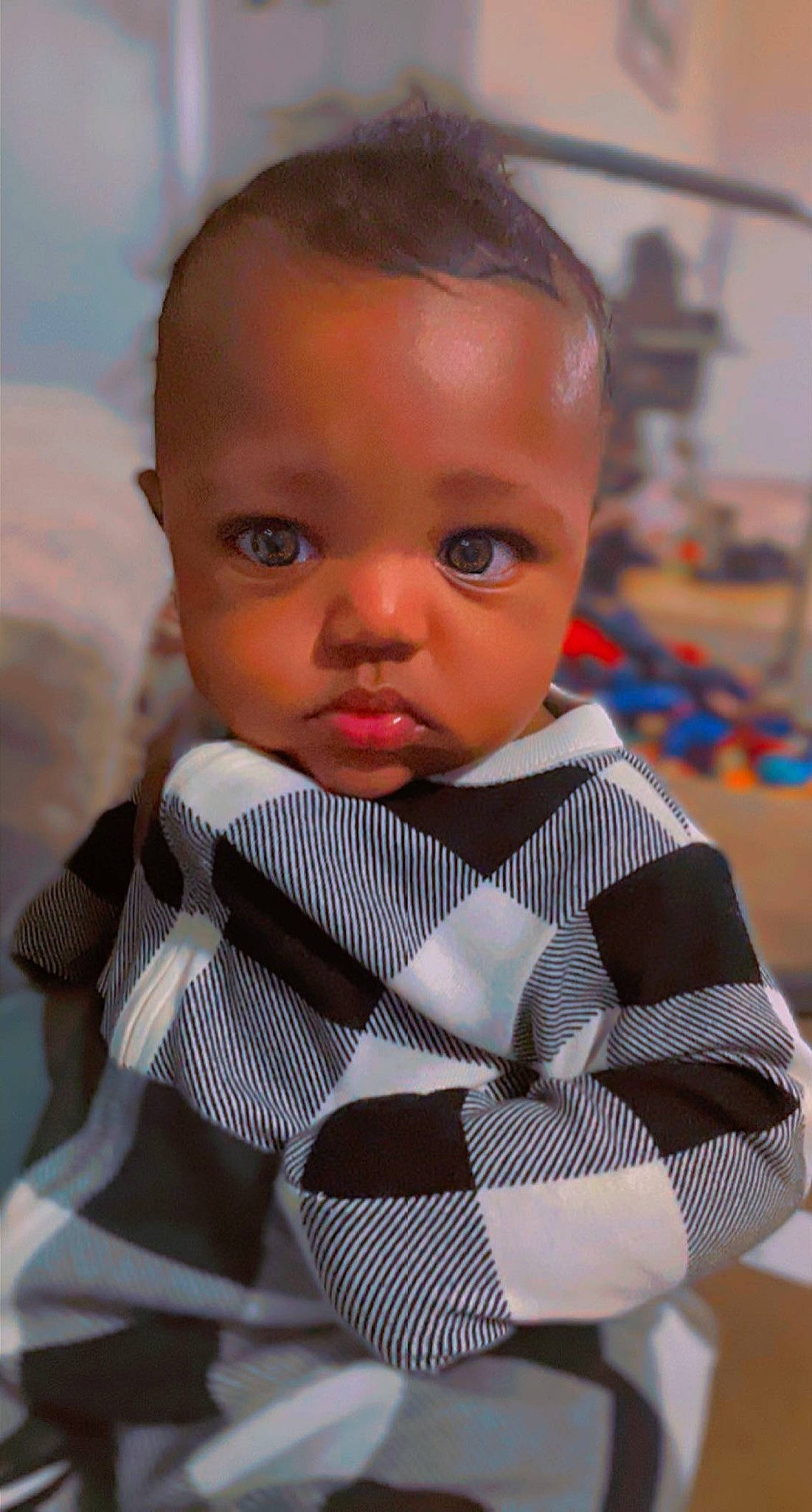 Jahlil is registered to the contest to win money with this photo: baby, baby_toddler_clothing, bow_tie, child, collar, fashion_design, formal_wear, happy, head, lip, pattern, person, plaid, room, sitting, sleeve, tie, toddler, tuxedo, vacation