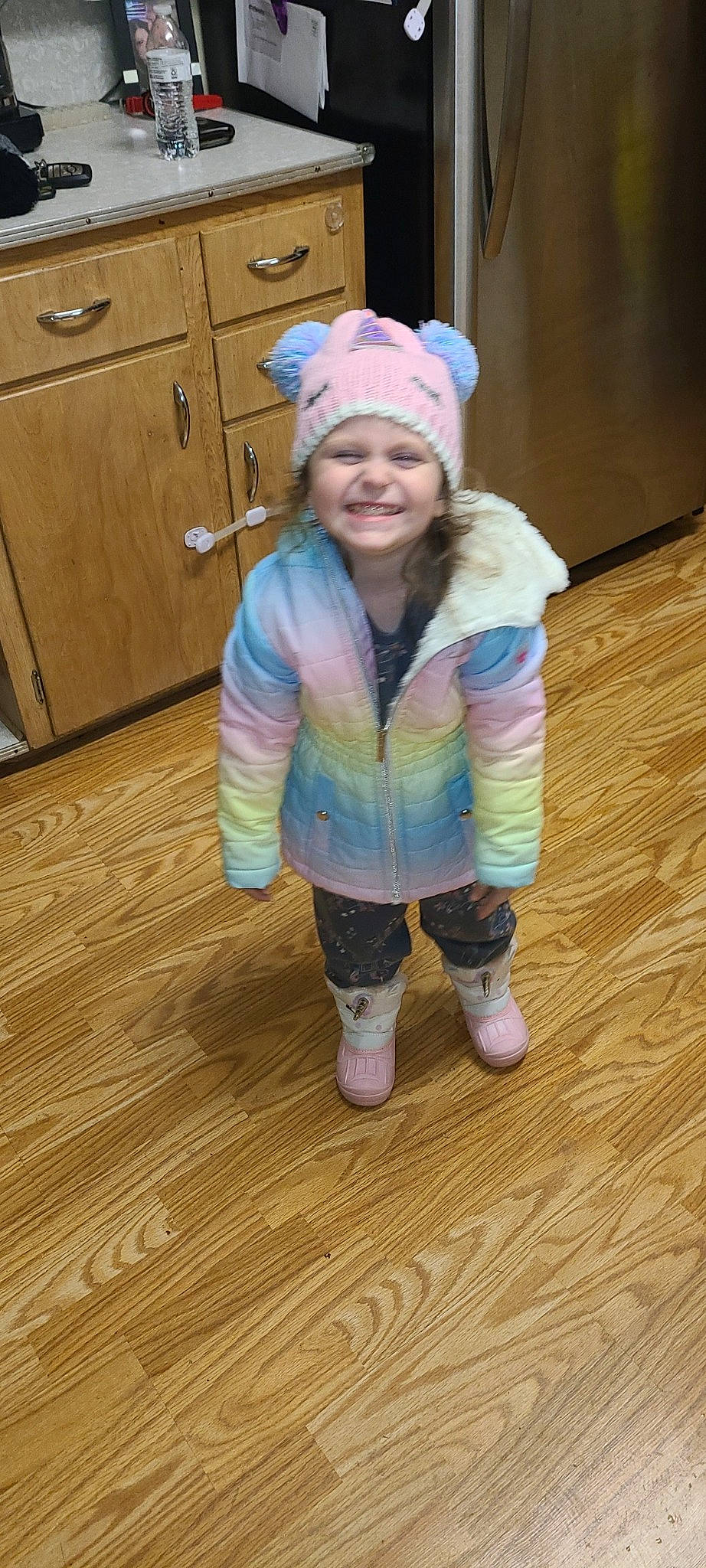 Dahlia joined the competition — help win amazing prizes! baby_toddler_clothing, cabinetry, cap, chest_of_drawers, cupboard, drawer, eye, flooring, happy, hardwood, hat, head, headgear, headwear, human_body, joy, person, smile, sock, standing