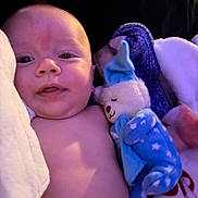 Stetson is registered to the contest to win money with this photo: baby, blanket, blue, child, comfort, cozy, cuddling, cute, face, indoors, infant, person, plush_toy, portrait, skin, sleepy, smile, soft_toy, star_pattern, warm