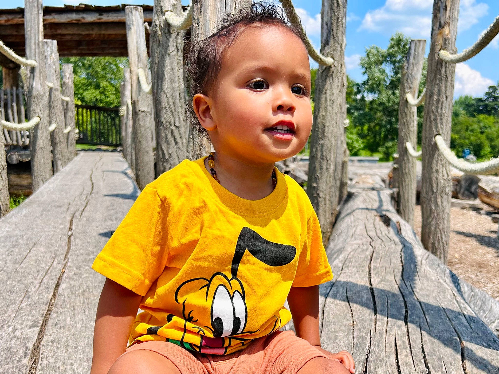 Emi is registered to the contest to win money with this photo: adaptation, botany, child, eyewear, facial_expression, fun, grass, happy, human, leaf, leisure, organ, people, person, recreation, sky, summer, t_shirt, toddler, travel