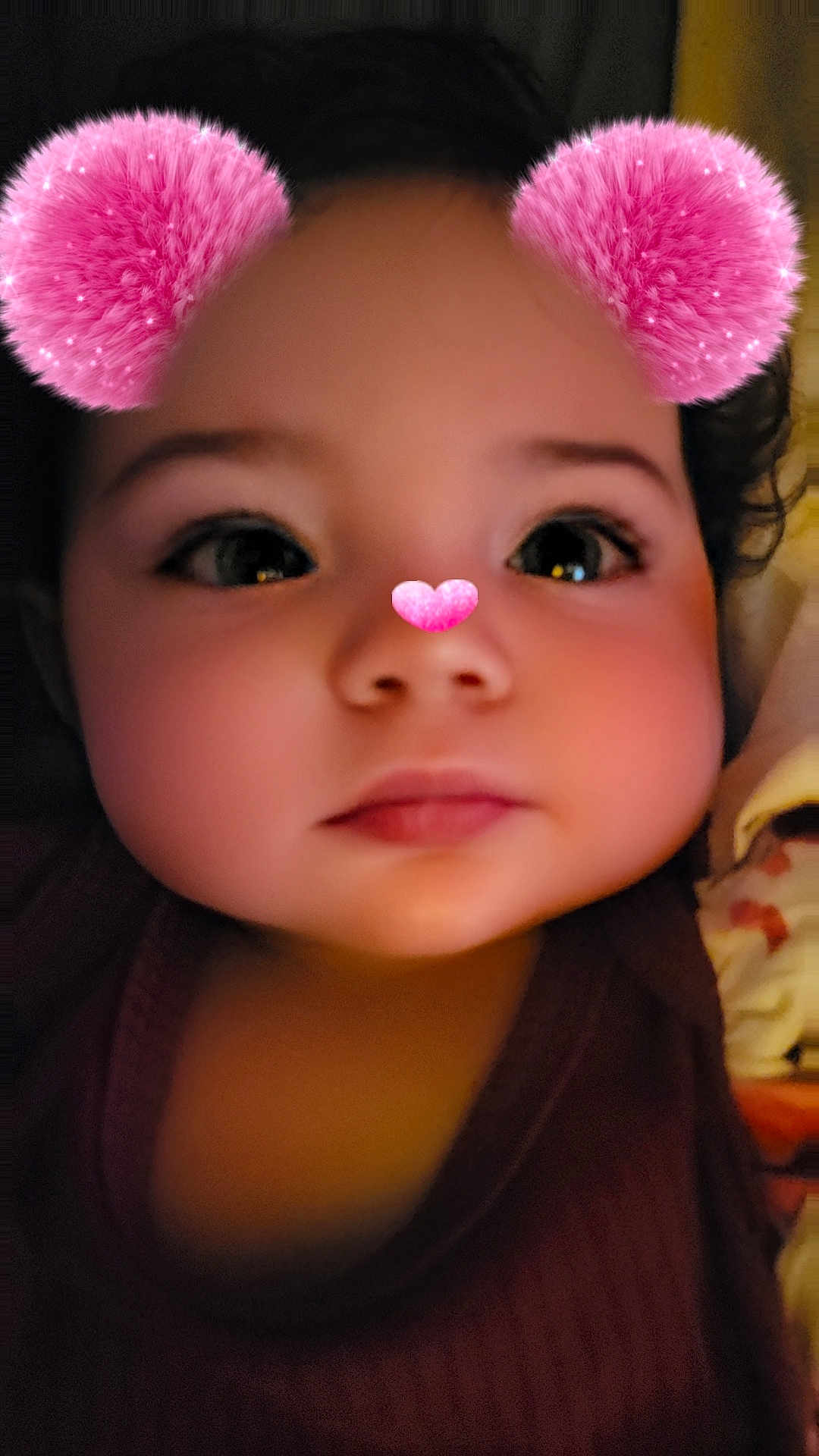 Kynlynn joined the competition — help win amazing prizes! baby, child, toddler, face, closeup, portrait, pink_ears, heart_nose, filter, snapchat_filter, eyes, lips, cheeks, curly_hair, indoors, blanket, clothing, adorable, soft_skin, cute