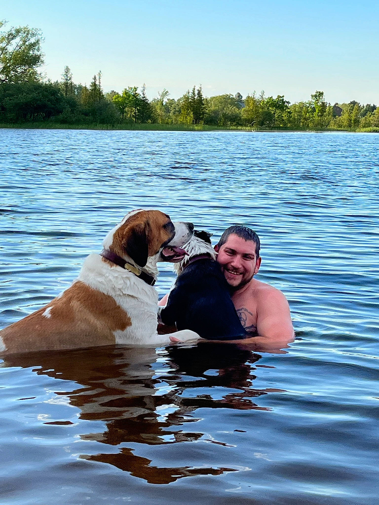 Jack joined the competition — help win amazing prizes! canidae, carnivore, companion_dog, dog, dog_breed, event, fun, happy, human_body, kiss, lake, leisure, recreation, shorts, sky, smile, sporting_group, tree, vertebrate, water