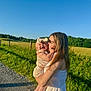 Kovelynn is registered to the contest to win money with this photo: baby, child, woman, outdoor, nature, field, grass, sky, sunlight, kiss, affection, smile, happy, holding, dress, headband, person, portrait, summer, love