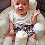 baby, child, infant, girl, headband, bow, leopard_print, skirt, socks, cushioned_chair, patterned, white_clothing, sitting, indoor, cute, expression, person, face, legs, small_container