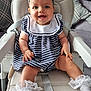 River-Rose is registered to the contest to win money with this photo: baby, child, high_chair, smiling, headband, striped_dress, white_socks, lace, happy, indoor, person, cute, infant, seated, blue_eyes, hands, legs, furniture, soft_lighting, portrait
