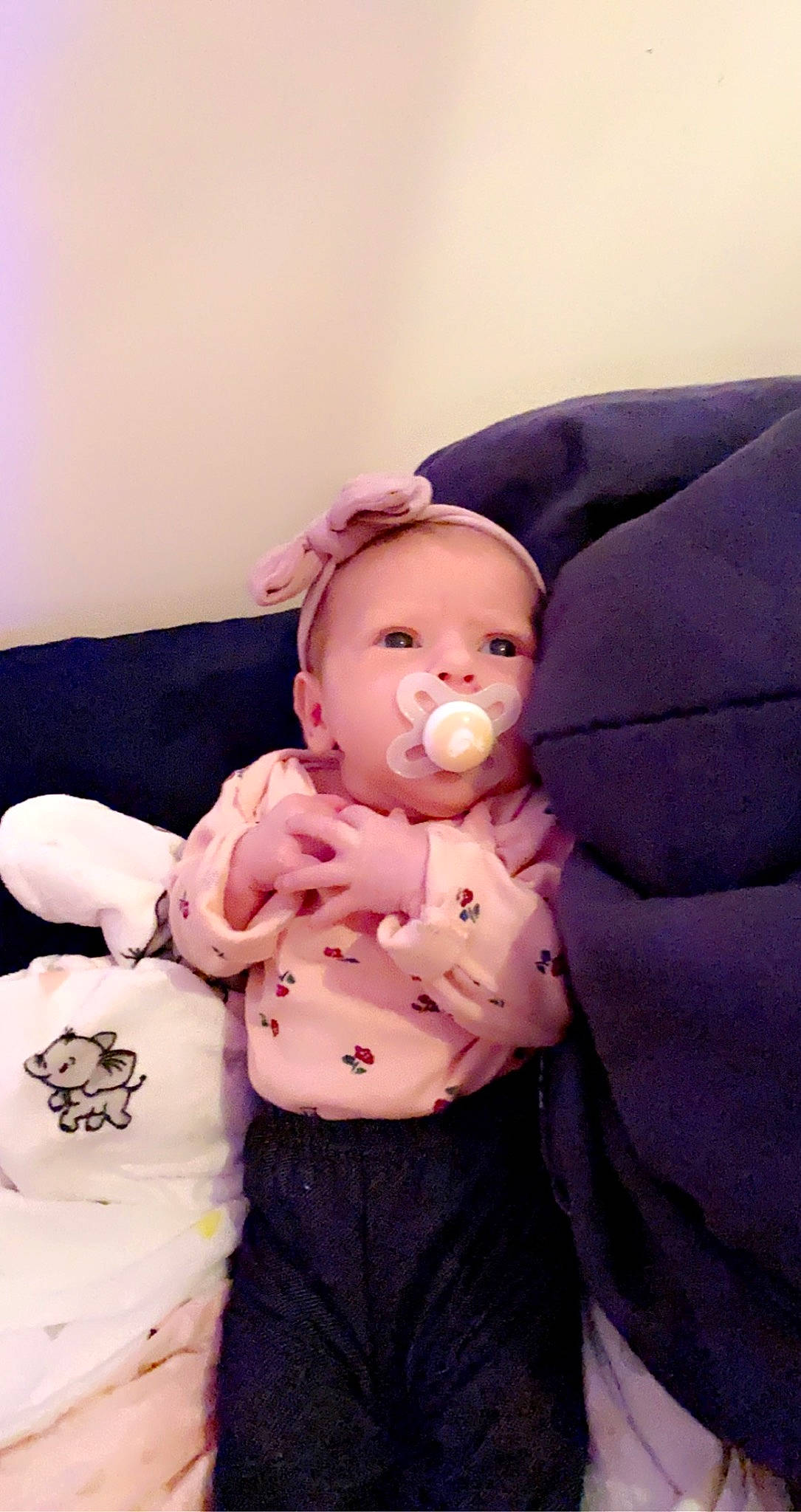 Eliana joined the competition — help win amazing prizes! abdomen, baby, baby_toddler_clothing, cheek, child, comfort, elbow, face, gesture, happy, human_body, person, pink, purple, sitting, skin, sleeve, stomach, textile, toddler