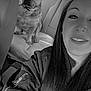 woman, dog, car_interior, seat, blanket, smile, long_hair, jacket, collar, pet, companion, portrait, backseat, window, monochrome, travel, leisure, vehicle, indoor, casual