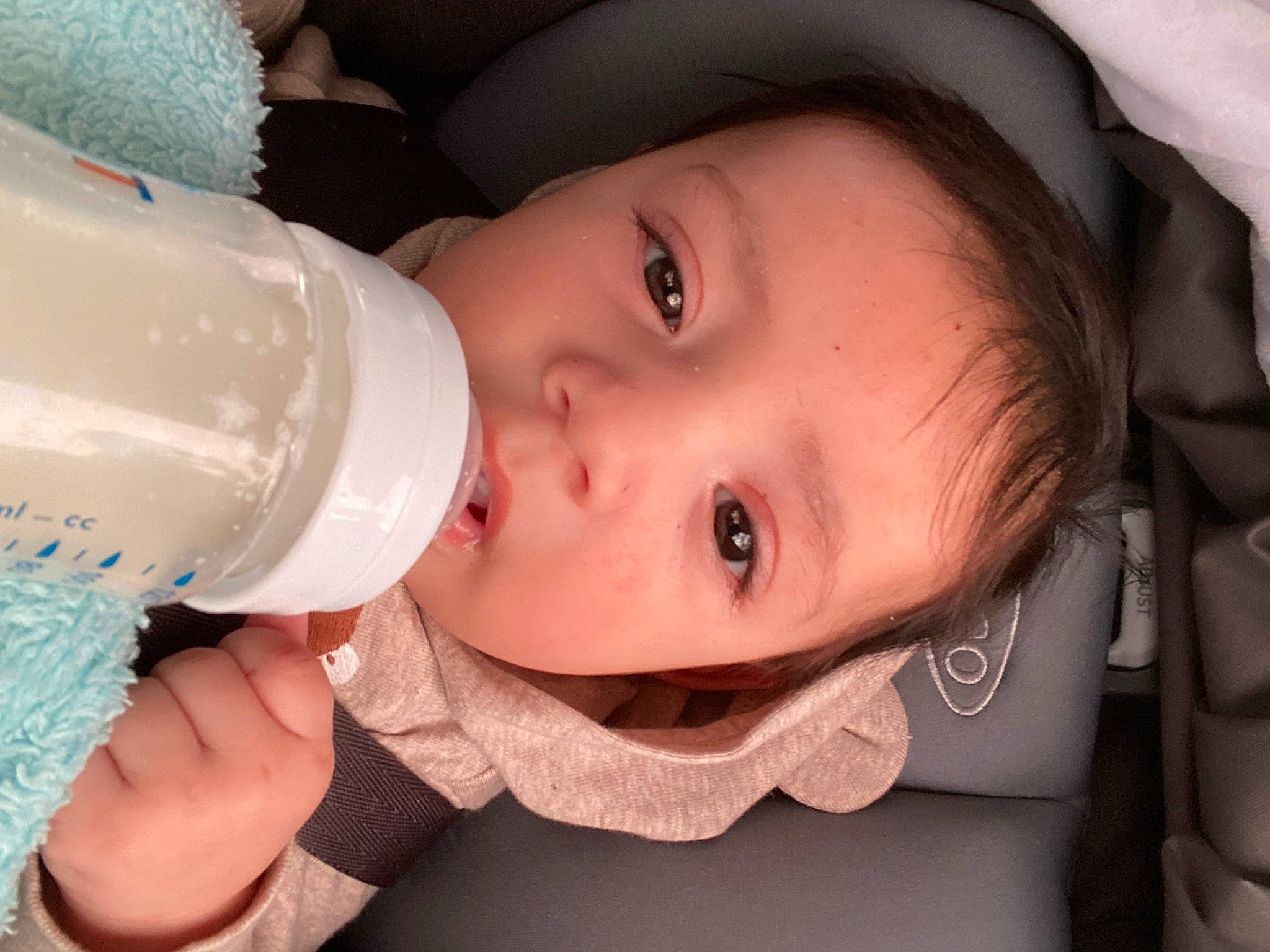 Adriel joined the competition — help win amazing prizes! baby, baby_bottle, bottle, cheek, drinkware, eyebrow, eyelash, face, facial_expression, fluid, hairstyle, hand, head, iris, lip, mouth, neck, nose, person, product