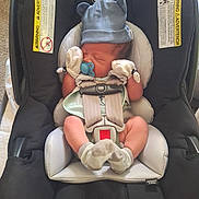 Michael joined the competition — help win amazing prizes! newborn, baby, car_seat, pacifier, hat, mittens, sleeping, infant, safety_strap, child, cute, cozy, soft, resting, clothing, headwear, indoors, seat, baby_gear, peaceful