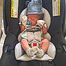 newborn, baby, car_seat, pacifier, hat, mittens, sleeping, infant, safety_strap, child, cute, cozy, soft, resting, clothing, headwear, indoors, seat, baby_gear, peaceful