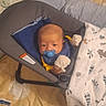 Michael is registered to the contest to win money with this photo: baby, pacifier, mittens, baby_seat, blanket, pillow, bed, infant, face, person, nursery, sleepwear, comfort, indoors, cute, child, resting, soft_toys, toddler, cozy