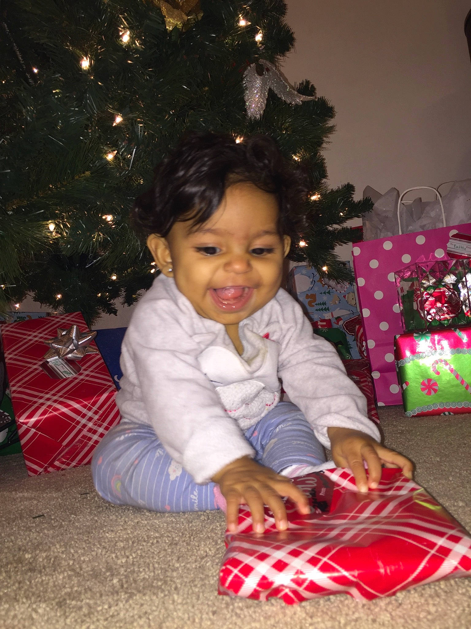 Zariah joined the competition — help win amazing prizes! child, christmas, christmas_decoration, christmas_eve, christmas_ornament, christmas_tree, event, gift_wrapping, holiday, interior_design, opening_presents, pajamas, person, play, present, toddler, tree