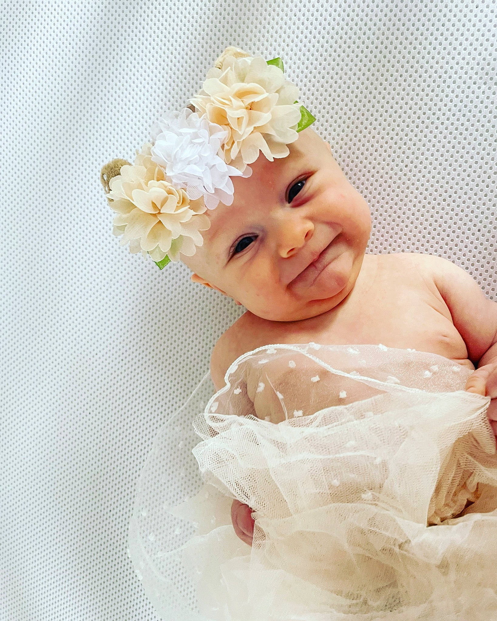 Rosie Blue is registered to the contest to win money with this photo: baby, baby_toddler_clothing, bridal_accessory, child, dress, embellishment, flower, hair_accessory, happy, headband, headgear, headpiece, headwear, jewellery, joy, person, petal, pink, plant, skin