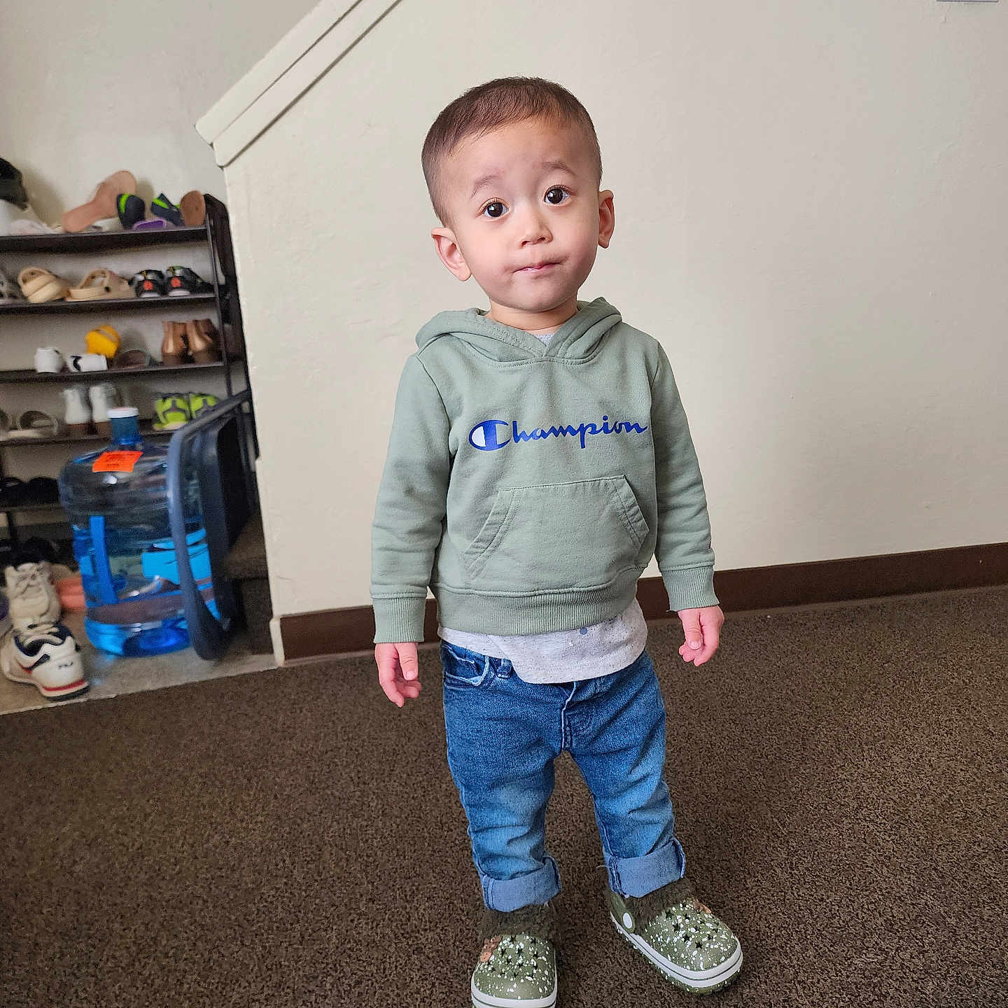 Vegas is registered to the contest to win money with this photo: accessories, bag, boy, child, clothing, cup, footwear, jeans, knitwear, longsleeve, male, pants, person, shelf, shoe, sleeve, sneaker, standing, sweater, wood