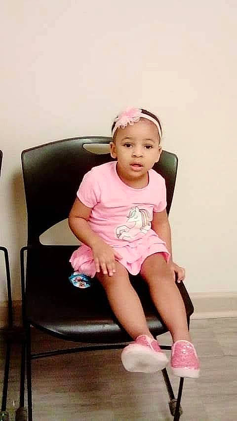 Izabella joined the competition — help win amazing prizes! baby, baby_toddler_clothing, chair, child, comfort, face, happy, human_leg, knee, leg, magenta, neck, person, pink, shorts, sitting, sleeve, sock, t_shirt, thigh