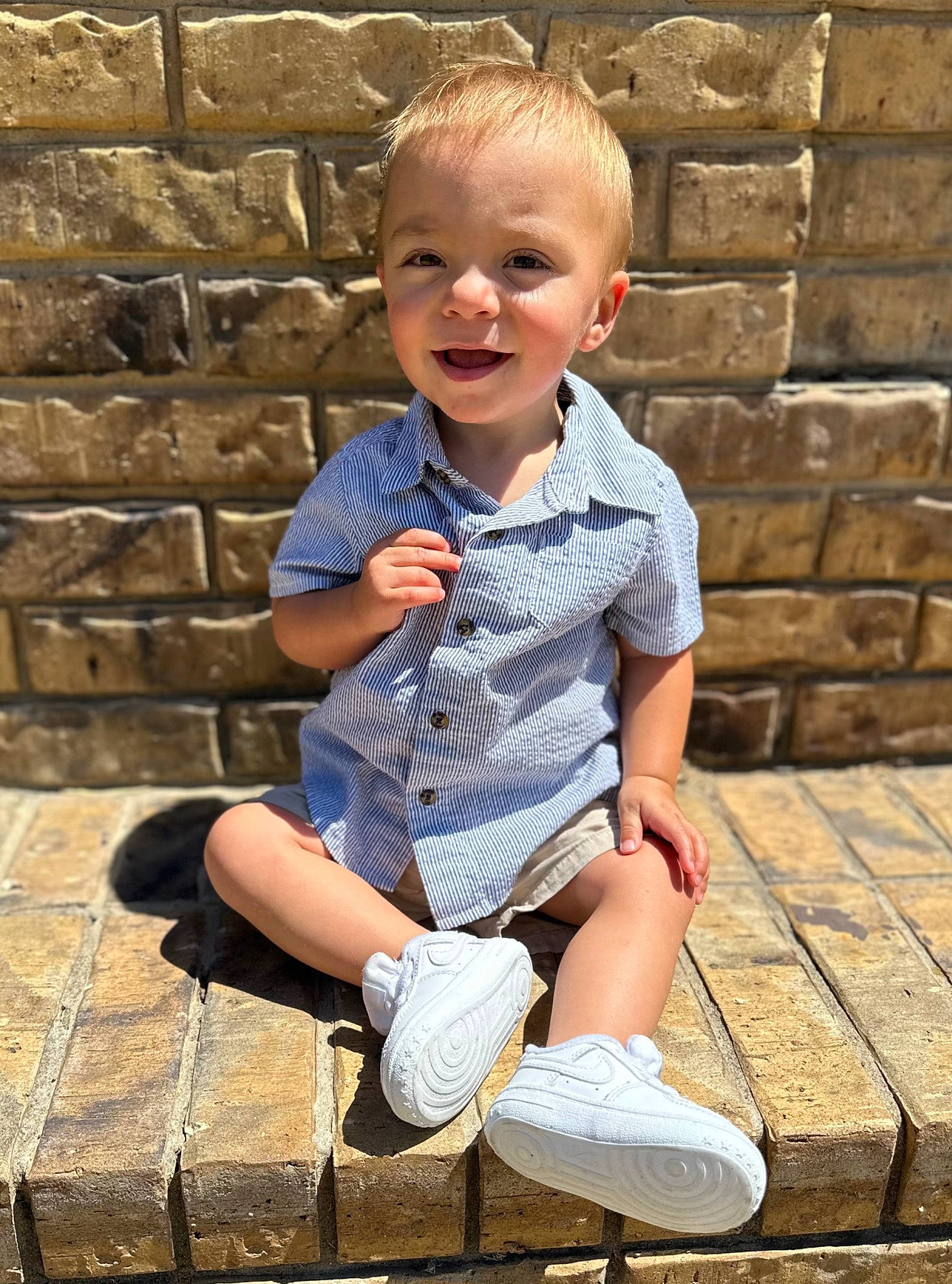 Layton joined the competition — help win amazing prizes! baby_toddler_clothing, brick, brickwork, child, denim, electric_blue, face, grass, happy, leisure, pattern, person, photograph, shoe, sitting, sleeve, smile, snapshot, t_shirt, toddler