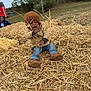 Shawn joined the competition — help win amazing prizes! boots, child, cloudy_sky, daytime, field, fun, grass, happy, hat, jacket, jeans, nature, outdoor, person, pile, play, smiling, straw, toddler, tree