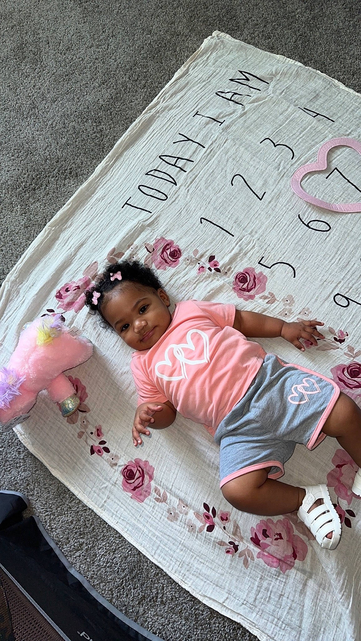 Emani is registered to the contest to win money with this photo: baby, baby_products, baby_toddler_clothing, bedding, child, comfort, font, fun, happy, linens, magenta, pattern, person, pink, play, sitting, toddler