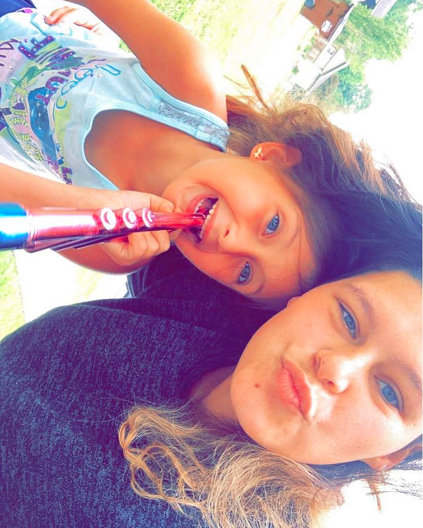 Lexi is registered to the contest to win money with this photo: brown_hair, child, cool, eyebrow, eyelash, eyewear, facial_expression, fun, grass, happy, hat, iris, leisure, lip, long_hair, mouth, neck, nose, person, plant