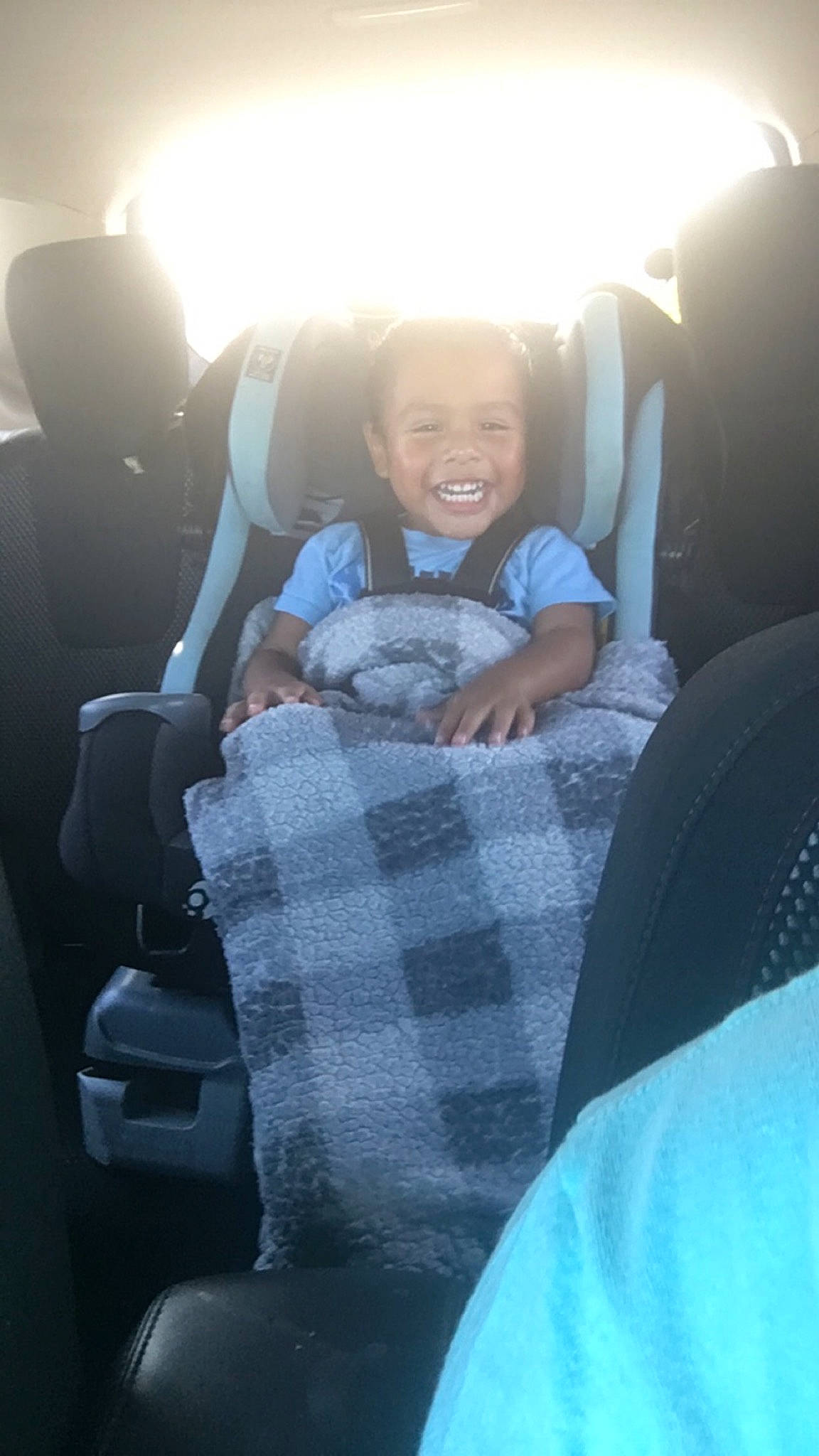 Kenneth is registered to the contest to win money with this photo: auto_part, automotive_design, automotive_exterior, baby, car_seat, car_seat_cover, child, comfort, electric_blue, family_car, fun, head_restraint, joy, lap, luxury_vehicle, motor_vehicle, person, sitting, sky, smile