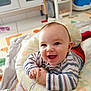 Charly participe au concours pour gagner de l'argent avec cette photo : baby, smiling, infant, face, hands, cushion, striped_clothing, toy, play_mat, indoor, happy, child, cute, young, person, head, floor, expression, cheerful, bright