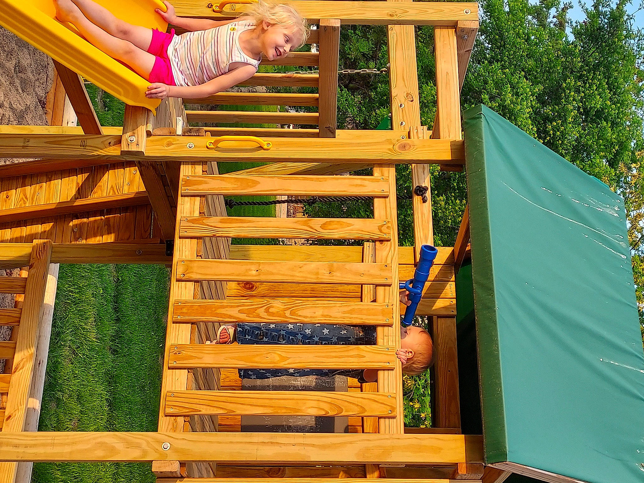 Charlilynn joined the competition — help win amazing prizes! fun, grass, green, happy, hardwood, joy, leisure, lumber, nature, outdoor_furniture, outdoor_play_equipment, person, plank, playground, recreation, shade, shorts, tarpaulin, tree, wood