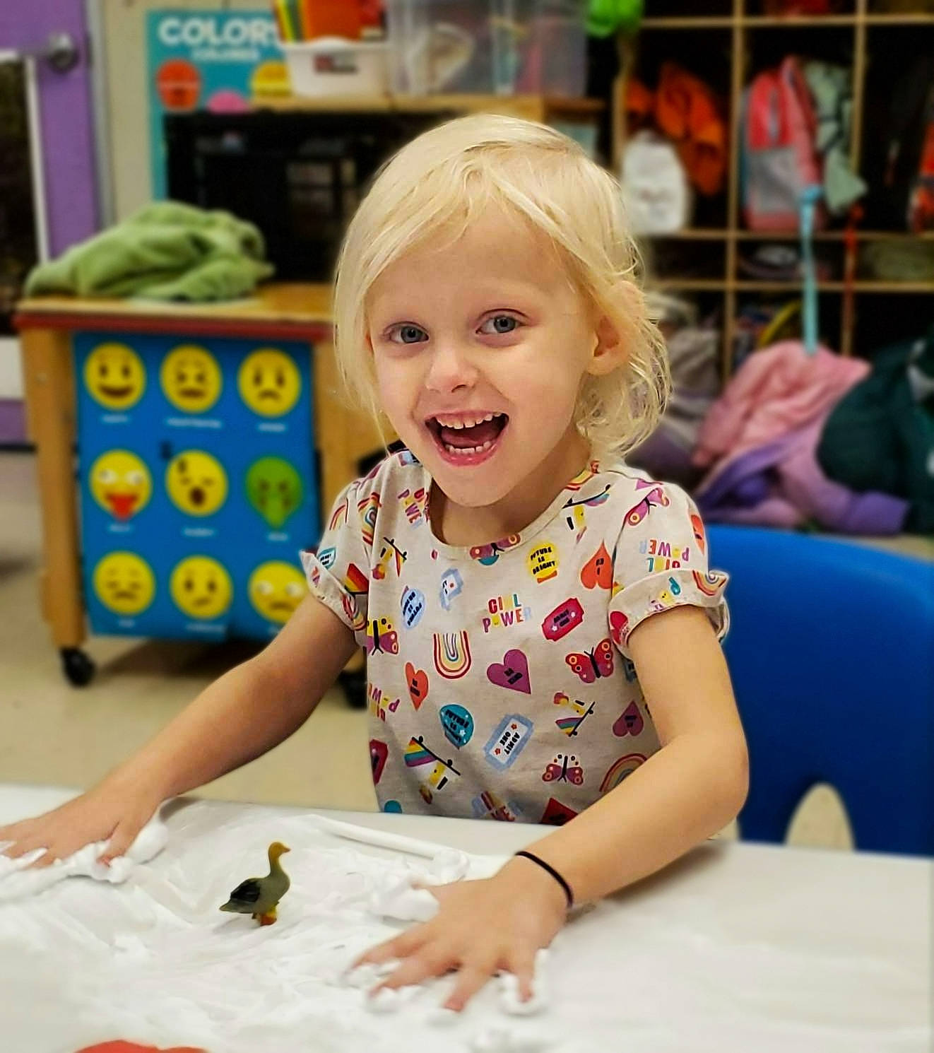 Charlilynn joined the competition — help win amazing prizes! chair, child, event, facial_expression, flooring, fun, hairstyle, happy, leisure, office_supplies, people, person, play, room, sitting, smile, snapshot, summer, t_shirt, table