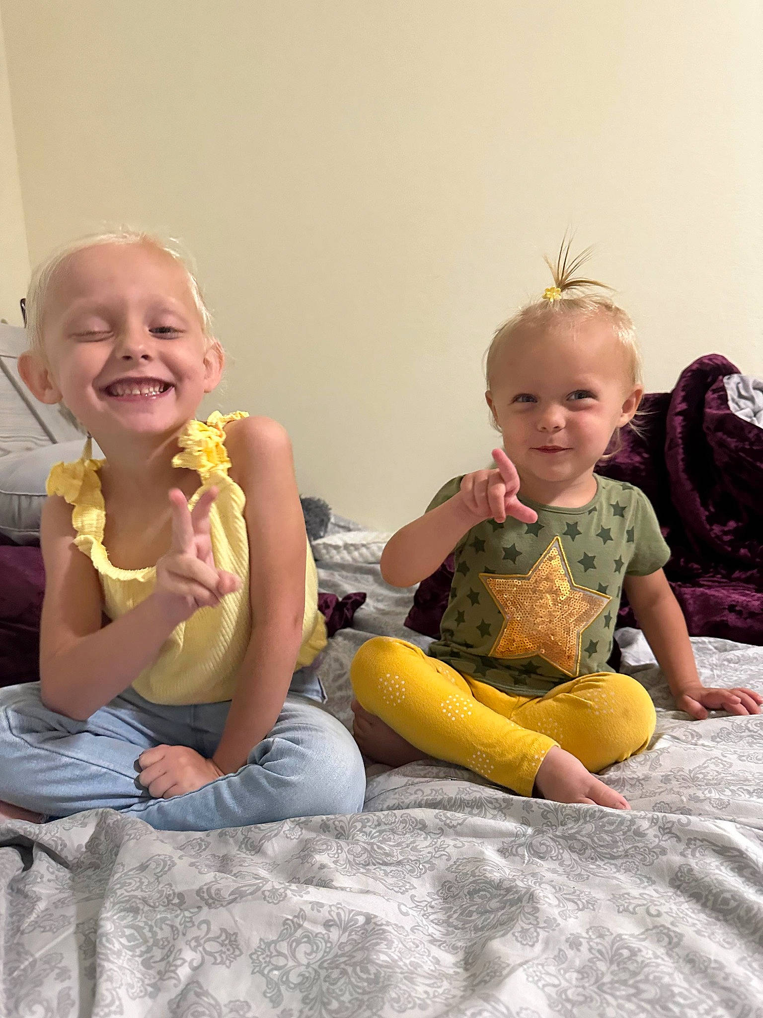 Rayla is registered to the contest to win money with this photo: baby, baby_toddler_clothing, child, comfort, face, finger, fun, gesture, happy, head, interaction, joy, lap, leisure, person, playing_with_kids, sharing, skin, smile, standing