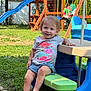 Bailee joined the competition — help win amazing prizes! toddler, child, smile, outdoor, grass, playground, slide, picnic_table, shorts, shirt, barefoot, sunny, playset, wooden_structure, backyard, summer, fun, happy, person, leisure