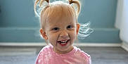 Bailee joined the competition — help win amazing prizes! child, toddler, smiling, sitting, indoor, blonde_hair, pigtails, pink_shirt, black_shorts, wooden_floor, window, blue_walls, happy, casual_clothing, portrait, person, young_child, cute, natural_light, home