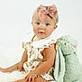 Bonnie joined the competition — help win amazing prizes! baby, child, bow, pink_bow, stuffed_animal, bunny, plush_toy, fluffy, white_background, rosy_cheeks, curious, portrait, cute, sitting, soft_toy, infant, clothing, dress, headband, studio_photo