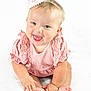 Bonnie joined the competition — help win amazing prizes! baby, child, birthday_hat, pink_clothing, smiling, happy, sitting, infant, cute, portrait, celebration, party_hat, hands, feet, face, skin, one_person, indoors, white_background, young_child