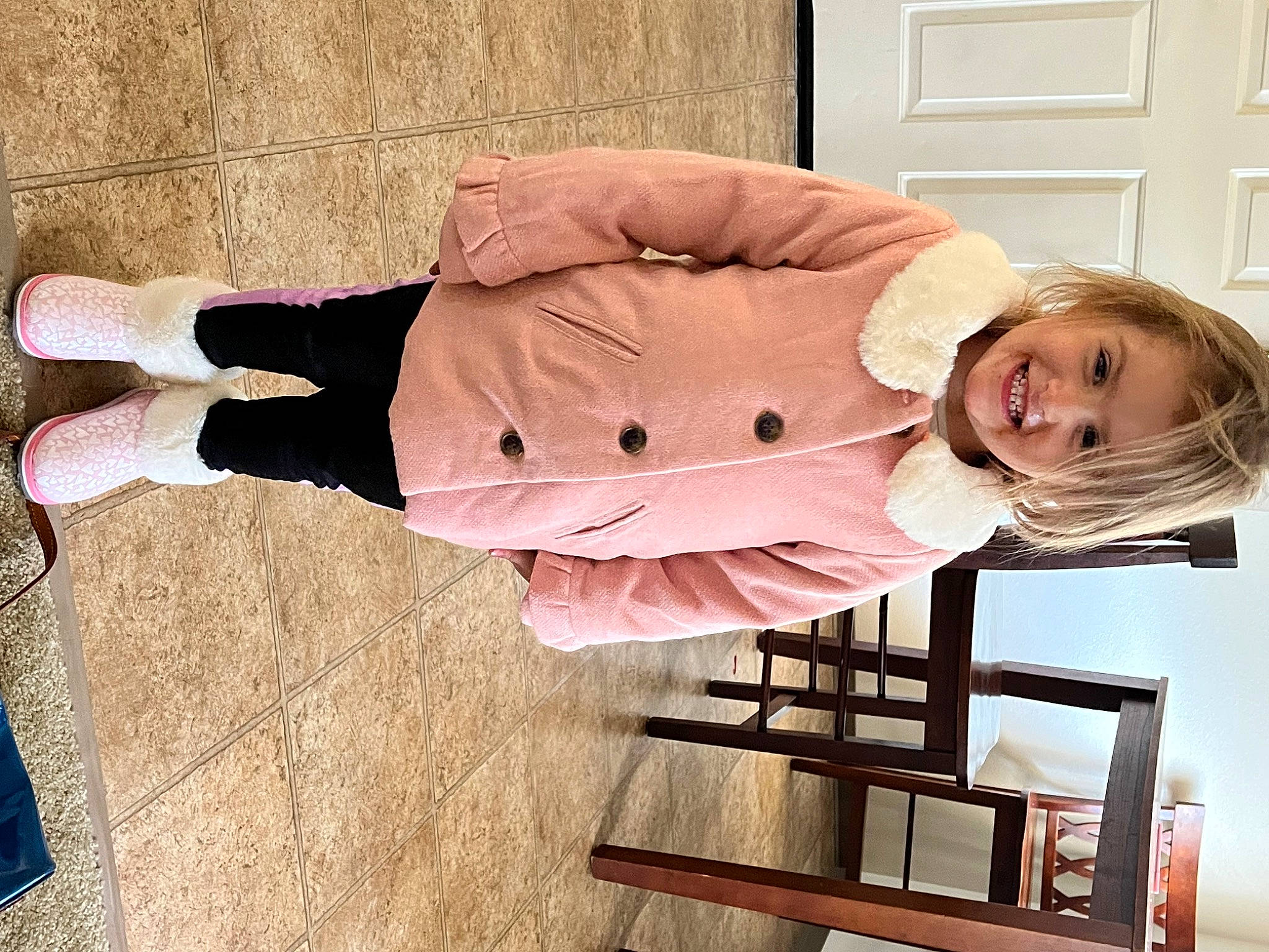 Amber joined the competition — help win amazing prizes! bar_stool, child, comfort, flooring, fun, happy, human_leg, jacket, joy, knee, pattern, person, pink, sitting, sleeve, smile, vintage_clothing, wood, wrist