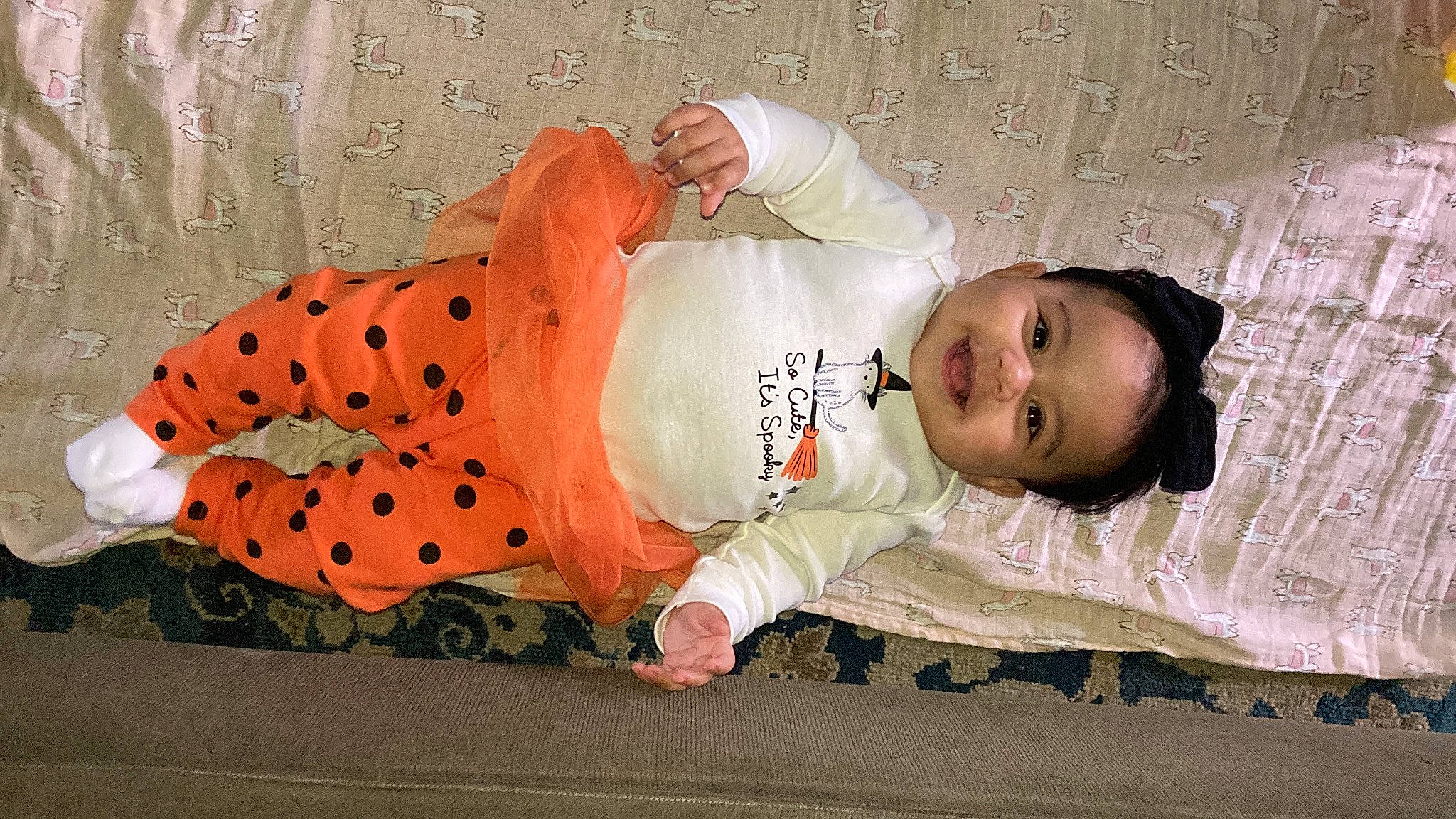 Jaylee joined the competition — help win amazing prizes! baby, baby_toddler_clothing, child, comfort, facial_expression, flooring, grass, human_body, linens, mammal, pattern, people, person, product, room, skin, sleeve, textile, toddler, vertebrate