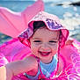 baby, blue_sky, child, cute, fun, happy, headwear, holiday, inflatable_float, outdoor, pink_hat, play, smiling, summer, sunny, swimming, toddler, toy, vacation, water