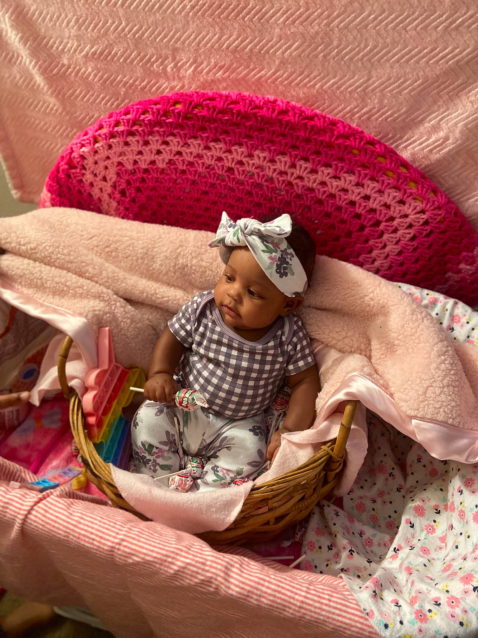 Malaysia is registered to the contest to win money with this photo: baby, baby_products, baby_sleeping, baby_toddler_clothing, basket, bedtime, child, comfort, couch, headgear, headwear, lap, linens, magenta, nap, person, room, sitting, skin, textile