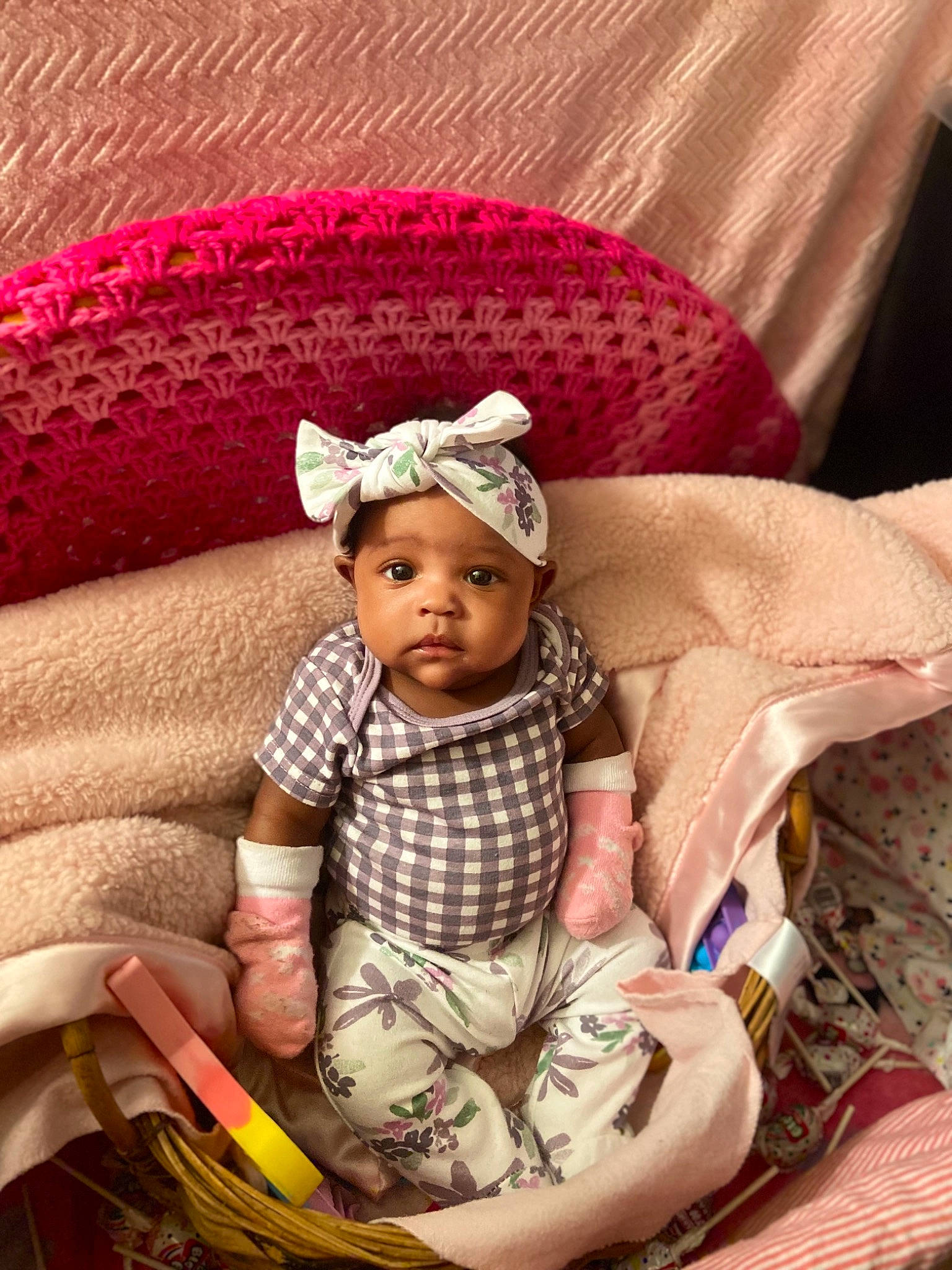 Malaysia is registered to the contest to win money with this photo: baby, baby_products, baby_toddler_clothing, beanie, cap, comfort, costume_hat, eye, fashion_accessory, head, headgear, headwear, knit_cap, linens, magenta, pattern, person, pink, sitting, sleeve