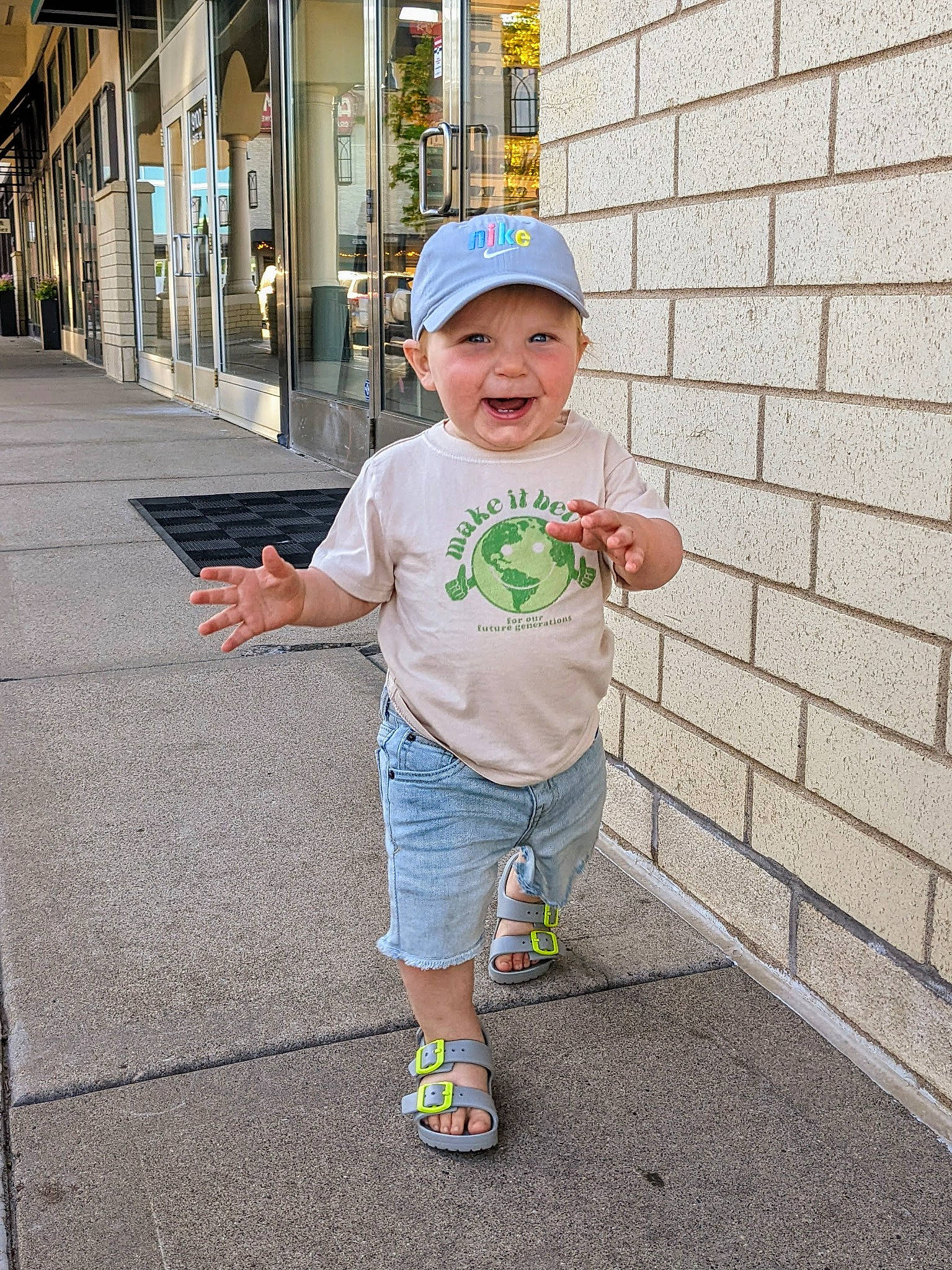 Vinny joined the competition — help win amazing prizes! asphalt, baby, baby_toddler_clothing, child, fashion_accessory, fun, happy, hat, headwear, leisure, pedestrian, person, recreation, road, sandal, shorts, sidewalk, sleeve, t_shirt, toddler